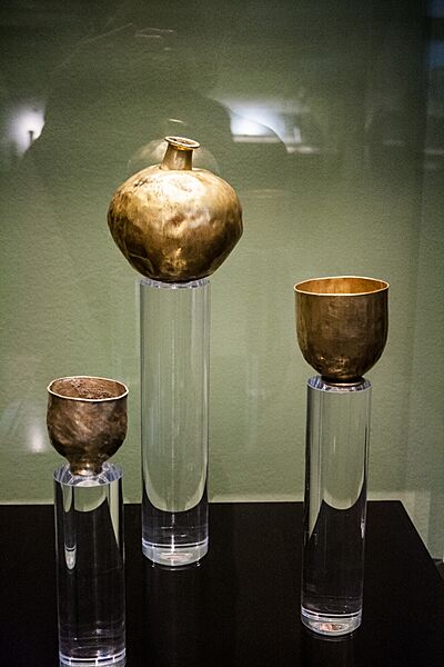 Golden bottle and goblets