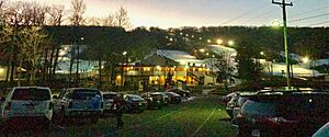Powder Ridge Mountain Park and Resort lodge, lit ski slopes and parking