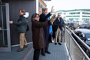 Secretary Kerry and Arctic Council Chairman Leona Aglukkaq wave to people in her hometown of Iqaluit, Canada