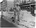 Street types of New York City- Street cleaner with pick ax standing in front of pile of snow LCCN2002699104