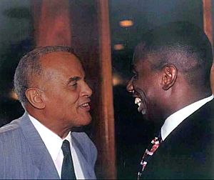 Harry Belafonte (left) with opera star Stacey Robinson in 1988