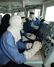 Pakistan Navy's sailors wearing anti-flash gear while operating a Guided missile frigate, PNS Alamgir 