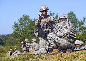 Defense.gov News Photo 100831-A-3843C-197 - U.S. Army Pfc. Joseph Guzman 1st Battalion 181st Infantry Regiment prepares to drop a 60mm mortar to launch at fixed targets at Camp Atterbury