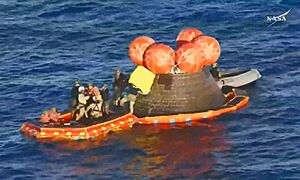 Integrity Capsule in the Sea with Navy Helping