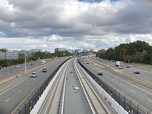 2018-10-29 13 59 27 View east along Virginia State Route 267 (Dulles Toll and Access Roads) and the Silver Line of the Washington Metro from the overpass for Virginia State Route 286 (Fairfax County Parkway) in Reston, Fairfax County, Virginia
