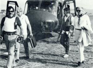 Armed Department of State security agents accompany U.S. Ambassador Deane Hinton in El Salvador circa 1982