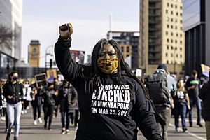 Attorney and civil rights activist, Nekima Levy Armstrong, leads a silent march for justice for George Floyd in downtown Minneapolis, Minnesota on the day before the beginning of the trial of Derek Chauvin (51013554148)