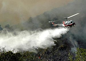 Helicopter sprays Santiago Fire in Foothill Ranch during 2007