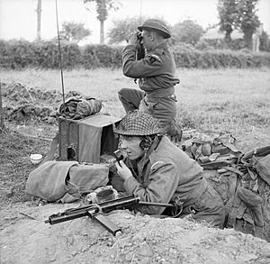 Men of the Durham Light Infantry operate a radio and keep watch for the enemy, near Bayeux, Normandy, 11 June 1944. B5378
