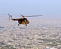 Mi-17 helicopter flies over the northern Afghan city-101113-N-5006D-582