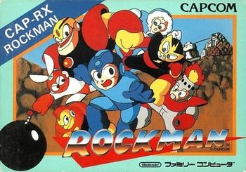 Image of a baby blue, rectangular box. The bottom portion reads "Rockman" along with a Nintendo Family Computer label below, while the artwork depicts a human robot boy in a blue outfit running from several robot characters. The landscape is a rocky valley with what appears to be a white structure in the distance.