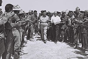 Cheering reserve soldiers greeting Levi Eshkol and min. Menahem Begin in Sinai. June 1967. D705-048