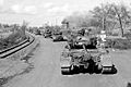 Convoy of Pershing tanks moves through a German town