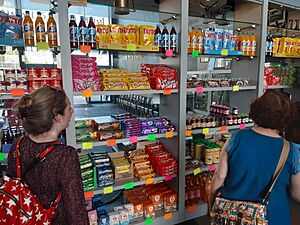 Republic of Ireland visitors to Manchester peruse Irish products for sale at the shop in the Irish World Heritage Centre, Cheetham Hill