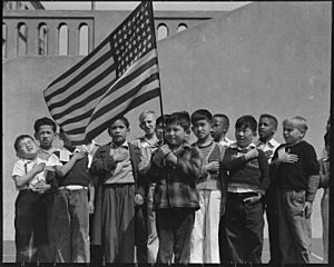 San Francisco, California. Flag of allegiance pledge at Raphael Weill Public School, Geary and Buch . . . - NARA - 536053