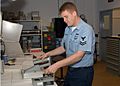US Navy 070208-N-9132D-002 Electronics Technician 2nd Class Shea Thompson tests an Alpha Particle Dection Probe