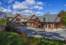 A wooden Tudor Revival-style building