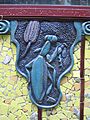 Ceramic plaque incorporated into the mosaic facades
