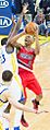 Damian Lillard shoots over Draymond Green