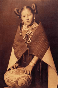 Hopi woman with a traditional pot and traditional clothing.png