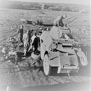 Italians repairing an amoured vehicle in East Africa