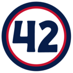 The number "42" in navy blue set against a white circle with a red and navy border