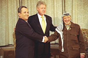 President Bill Clinton with Prime Minister Ehud Barak of Israel and Chairman Yasser Arafat of the Palestinian Authority