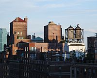Rooftop water towers on New York apartment buildings