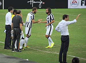 Singapore Selection vs Juventus - 2014 - Marco Motta, Andrea Pirlo, Max Allegri (cropped)