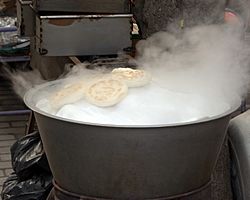 Steaming bread in Xi'an's Muslim Quarter.jpg