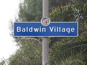 Street sign marking the border of the Baldwin Village neighborhood, located at the intersection of Obama Boulevard and  Martin Luther King Jr. Boulevard