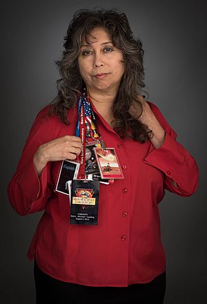 Nagin Cox with mission lanyards