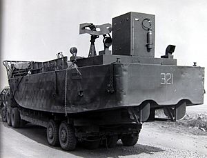 Rhine Crossing - a U.S. Third Army flatbed truck carrying a Navy LCM heads for the Rhine River