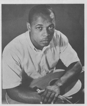 Promotional photograph of folk musician Al Cromwell, of Phinneys Cove, Nova Scotia, published in the 1963 program of the Mariposa Folk Festival.