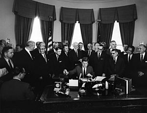 President John F. Kennedy Signs Communications Satellite Act of 1962 - AR7444-E