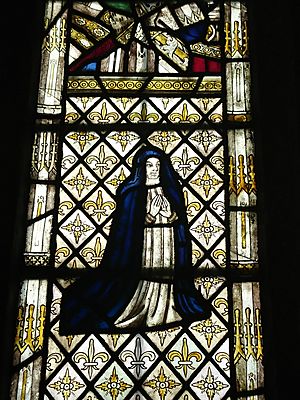Stained Glass kneeling abbess at Llanllugan church