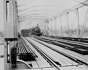 StateLibQld 2 270069 Steam engine crossing the Alexandra Railway Bridge at Rockhampton, 1899