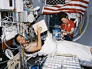 Crewmembers in the spacelab with the Lower Body Negative Pressure Study