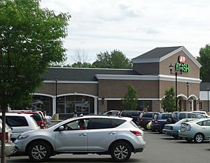 New Providence NJ shopping center with supermarket and cars