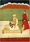 Painting of Guru Amar Das leaning against a bolster whilst seated on a raised platform on a terrace with a fly-whisk attendant.jpg