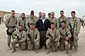 US Navy 041224-M-8096K-064 Secretary of Defense (SECDEF), Donald Rumsfeld takes a photo with some Marines at Camp Fallujah, Iraq