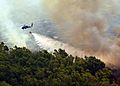 MH-60S Helicopter dumps water onto Fire