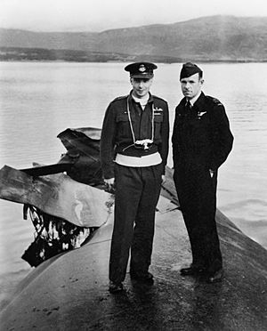 Willie Tait and an RAAF officer standing on the wreck of Tirpitz in 1945