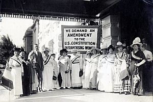 1915 Suffragists in the lobby of Hotel Utah with Senator Reed Smoot