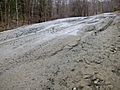 Frost heaves on Bragg Hill Road in Norwich Vermont in March 2012--C