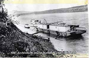 M.T. Liard River and her barge near the head of the rapids on the Bear River, 1932-08-20 - N-1981-002-0009