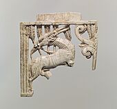 Openwork furniture plaque with a grazing oryx in a forest of fronds MET DP110622