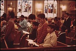 WORSHIPPERS AT HOLY ANGEL CATHOLIC CHURCH ON CHICAGO'S SOUTH SIDE. IT IS THE CITY'S LARGEST BLACK CATHOLIC CHURCH.... - NARA - 556238