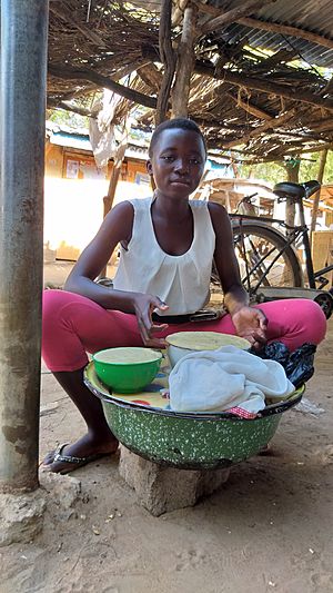 A young lady selling shea butter in Ghana