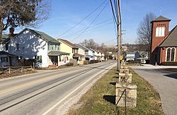 The main street, US Route 119, looking northeast from Cemetery Drive. Houses built for miners visible at left.